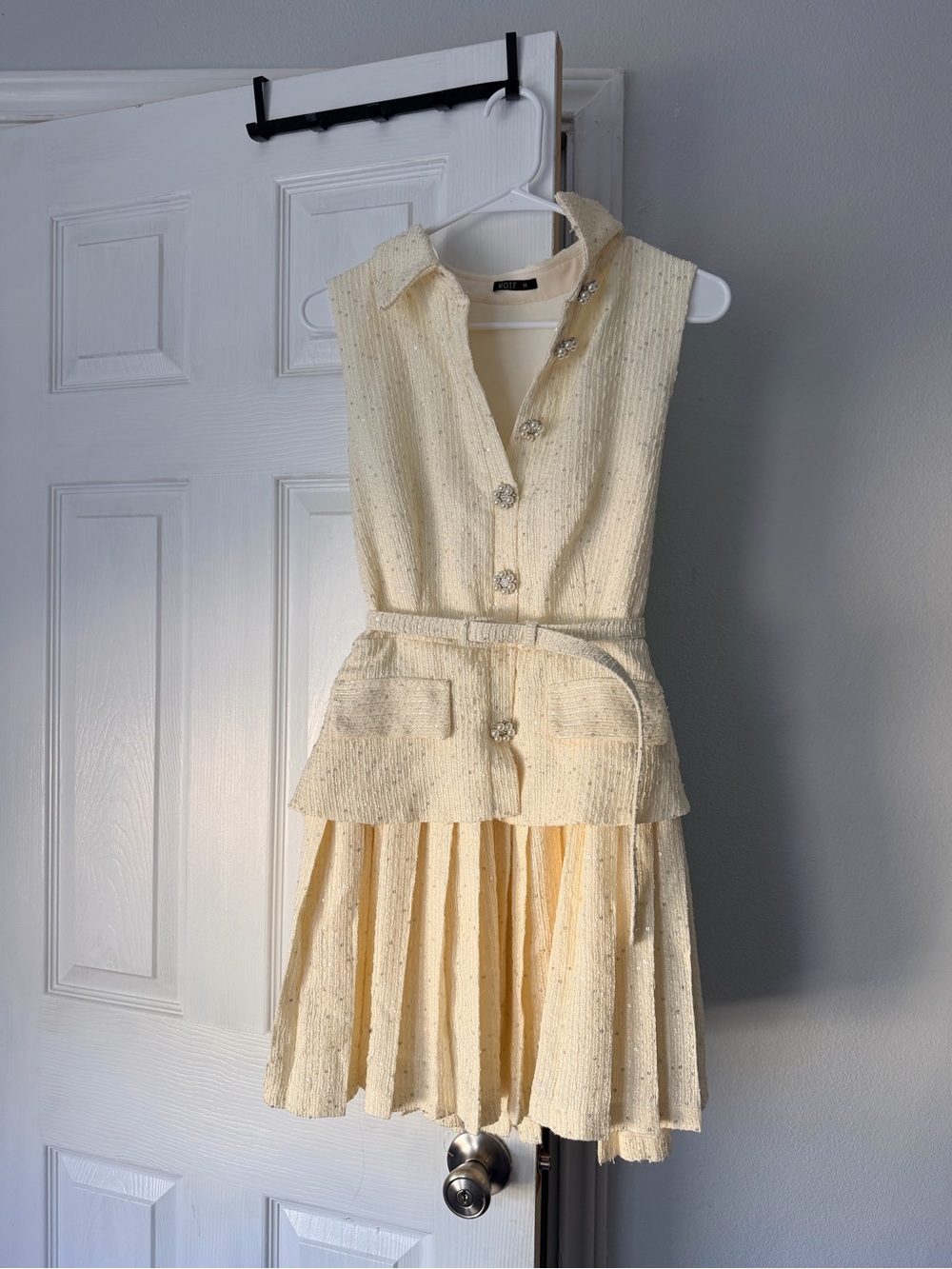 Woman . New never worn.Cream Textured Sleeveless Dress with Belt